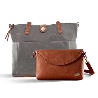 A grey canvas tote bag with caramel brown vegan leather accents and a matching brown vegan leather crossbody clutch in front, sitting on a white background.