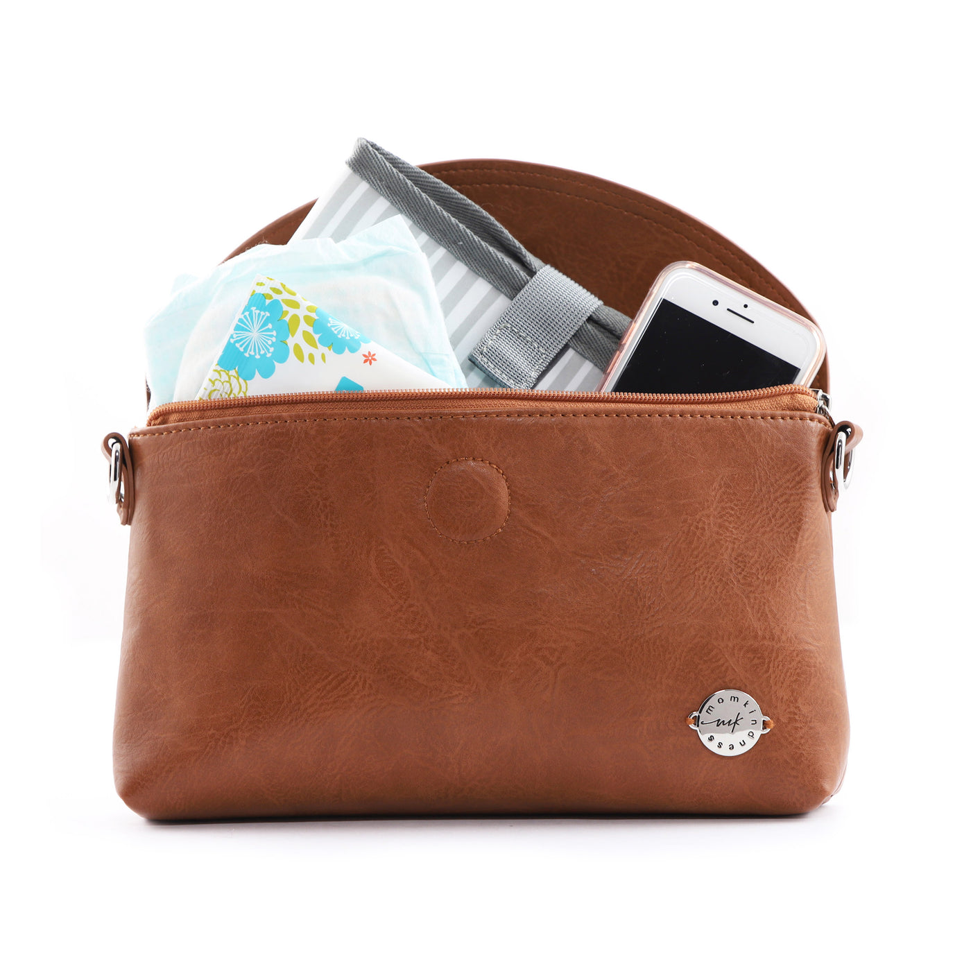 Brown vegan diaper clutch shown open and filled with diapers, wipes, phone and changing pad.