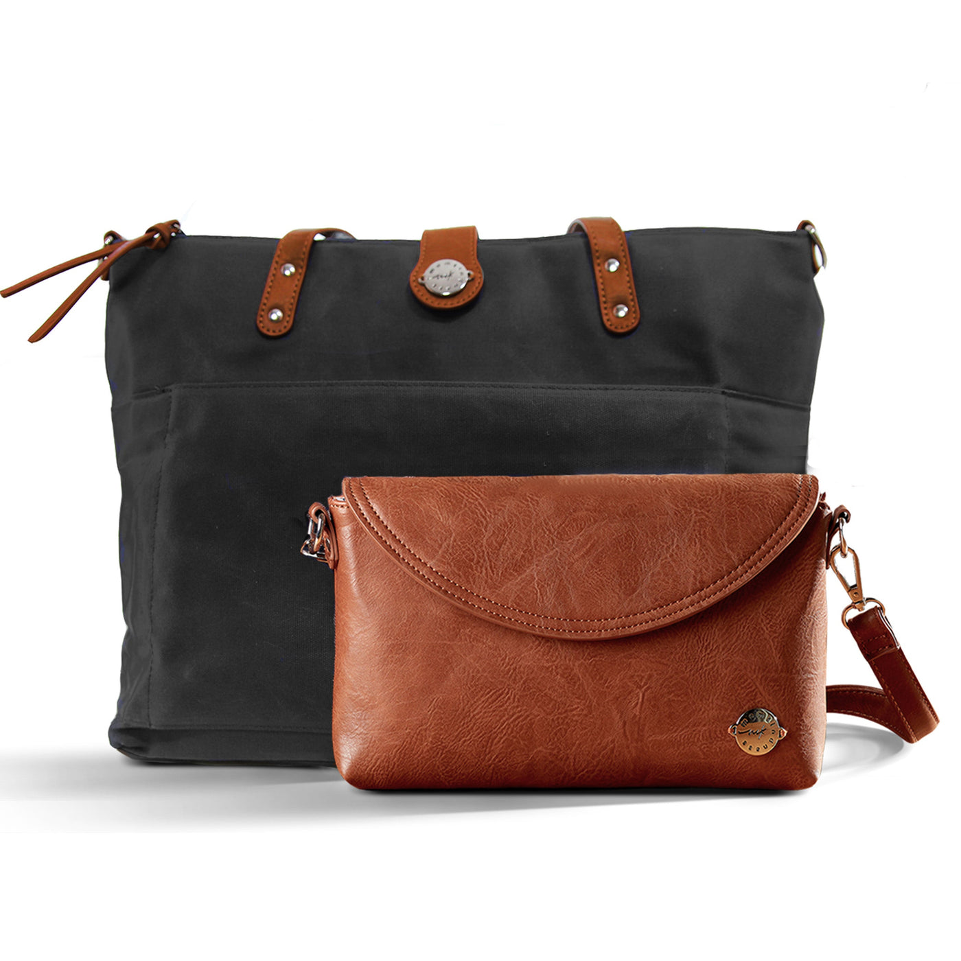 Black waxed canvas tote with brown vegan leather accents and brown vegan leather diaper clutch, all on a white background.