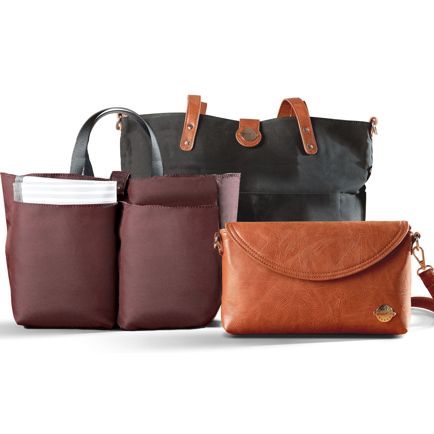 Carry All Tote Trio shown with three included components; black waxed canvas tote with brown vegan leather accents, brown vegan leather diaper clutch and burgundy multi-pocket organizer insert with carry handles.