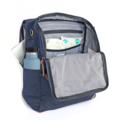 A front-facing 3/4 view of a navy blue backpack with front flap zipped open showing pockets inside, a water bottle in side pocket, and a laptop in separate back compartment. Wipe-clean lining is a thin black and white stripe pattern with black accents. Image shown on a white background.