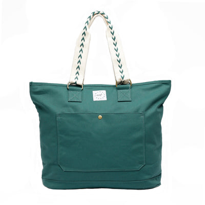 Large capacity Juniper Green colored canvas tote with off-white carry handles that have juniper green accent stitch. Front pocket has brass snap closure.