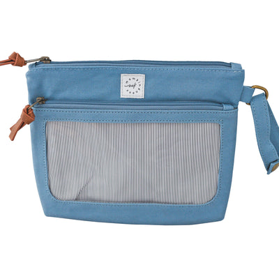 A dusty blue colored canvas pouch with 2 zip-close compartments, a clear view window and a wristlet strap, on a white background.