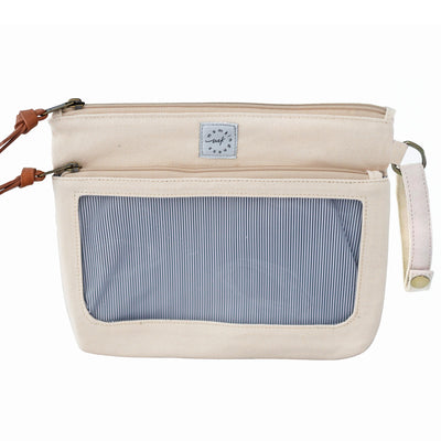 An ivory colored canvas pouch with 2 zip-close compartments, a clear view window and a wristlet strap, on a white background.