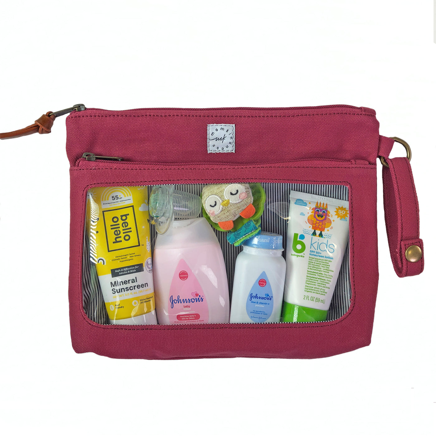 A berry colored canvas pouch with 2 zip-close compartments, a clear view window showing baby care items and a wristlet strap, on a white background.