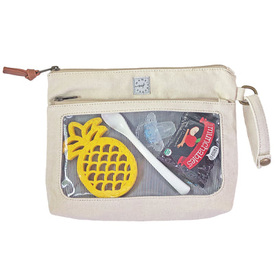An ivory colored canvas pouch with 2 zip-close compartments, a clear view window showing baby care items and a wristlet strap, on a white background.