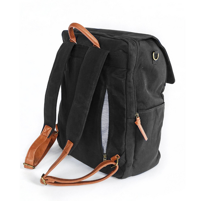 A back-facing 3/4 view of black waxed canvas backpack that shows zip-close back pocket in open position that conveniently stores items that need to be easily accessible. Side water bottle pocket and separate padded laptop pocket that has a zipper closure also shown. Image shown on white background.