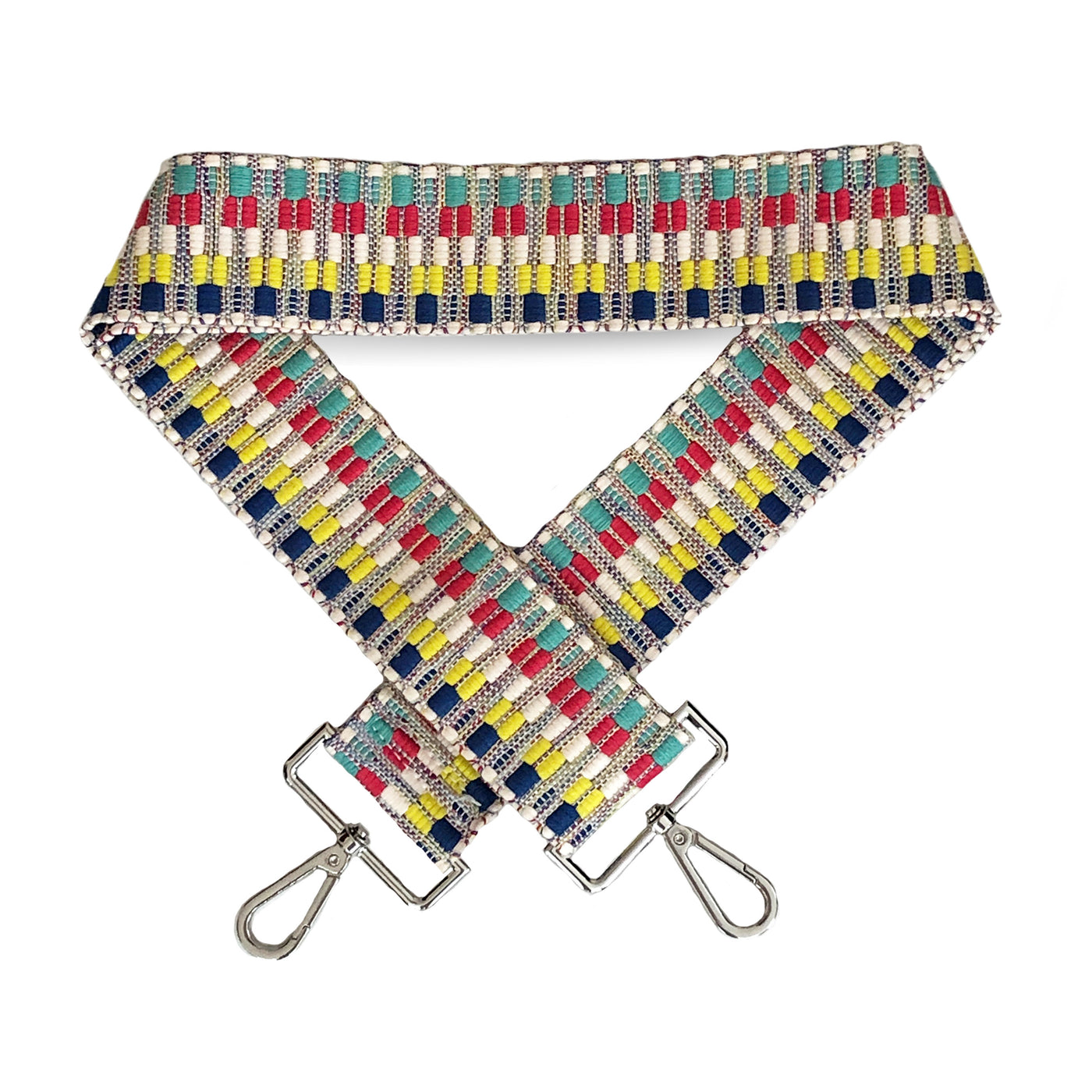 A colorful navy, white, red, yellow and teal patterned woven bag strap with silver metal buckles, shown laying on a plain white background. 