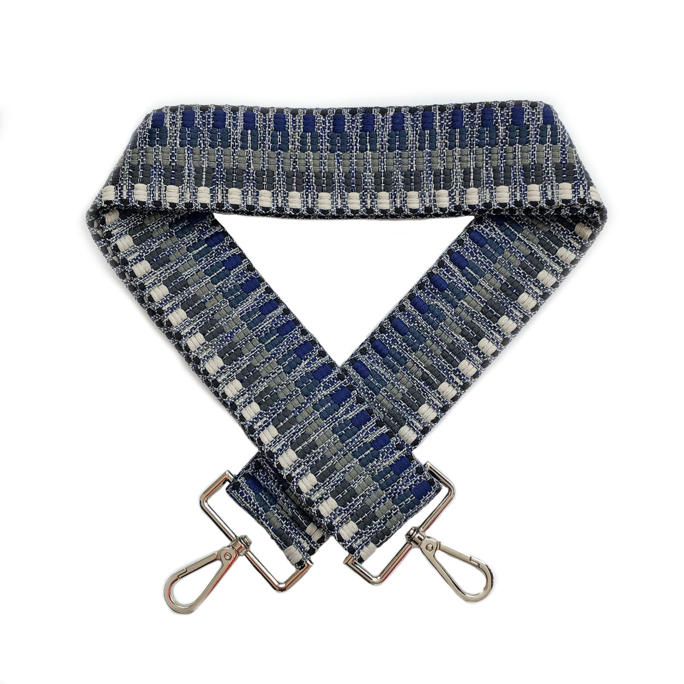 A navy blue, grey and off-white geometric patterned woven bag strap with silver metal buckles, shown laying on a plain white background.